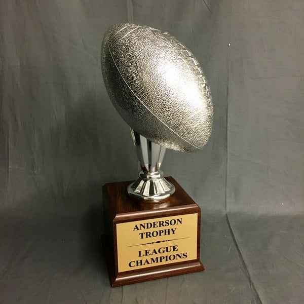 Silver Champions Football Trophy on Woodgrain Finish Base - AndersonTrophy.com